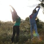 Two young women working out in the garden